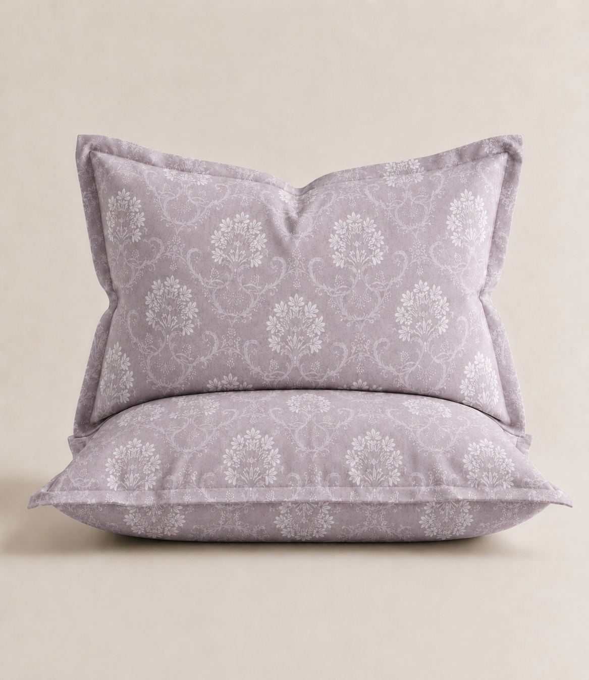 Matching king size pillow cover in misty lilac cotton featuring an intricate white floral vine damask pattern. Soft, breathable fabric complements the coordinating bedsheet for an elegant bedroom look.