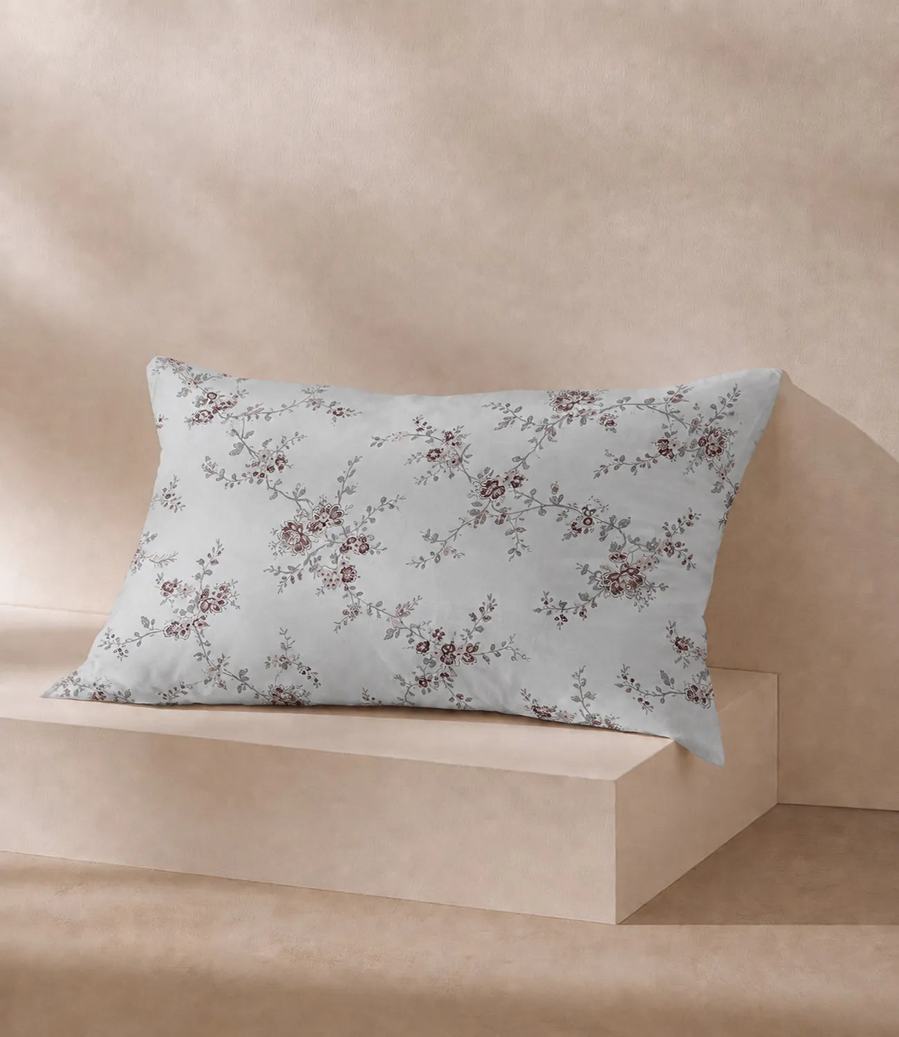 Matching ivory 100% cotton pillow cover featuring delicate dusty rose floral vine print with elegant botanical detailing on a soft white background.