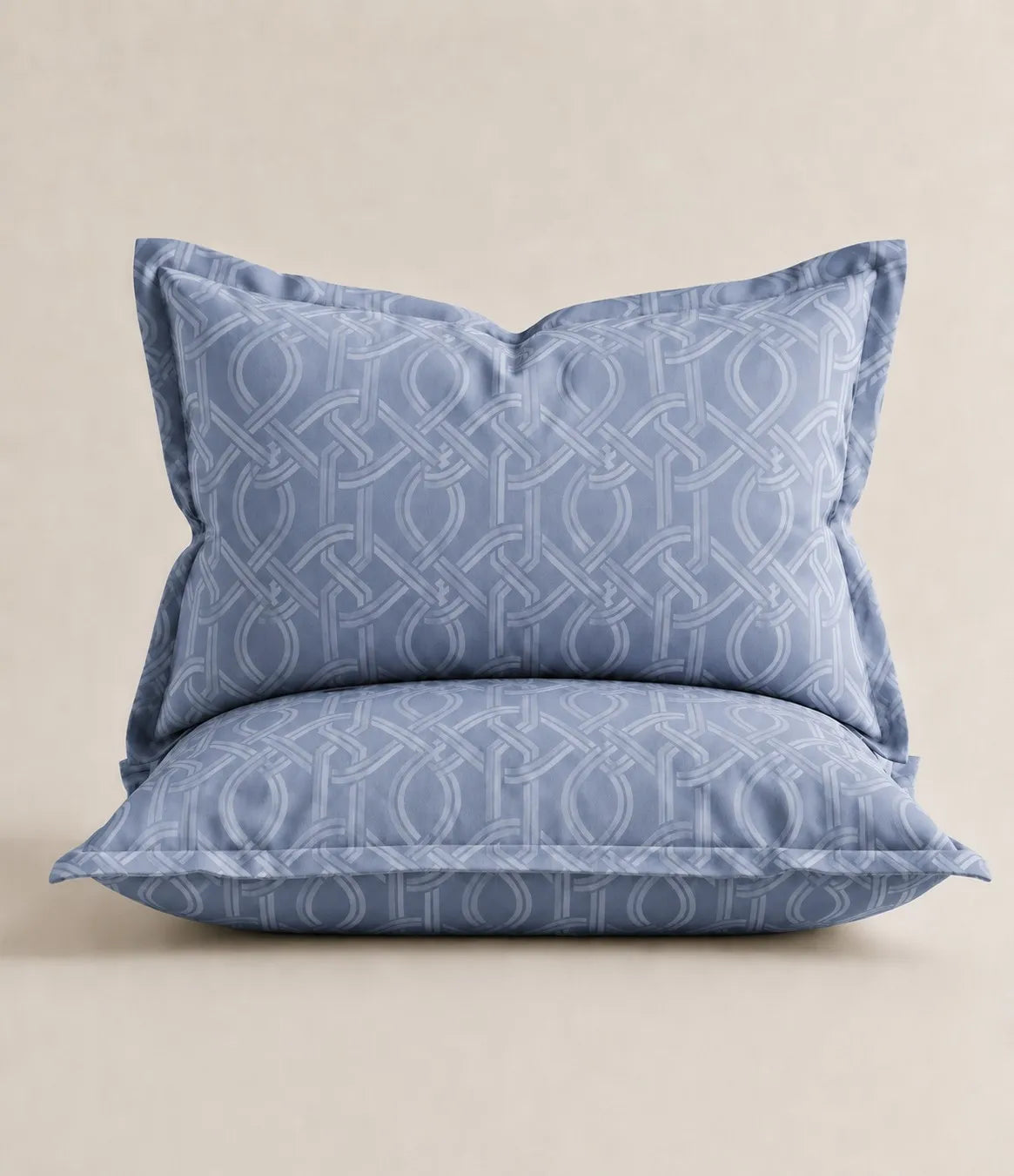 Matching powder blue cotton pillow covers featuring an elegant interwoven geometric pattern for king size bedsheet set.