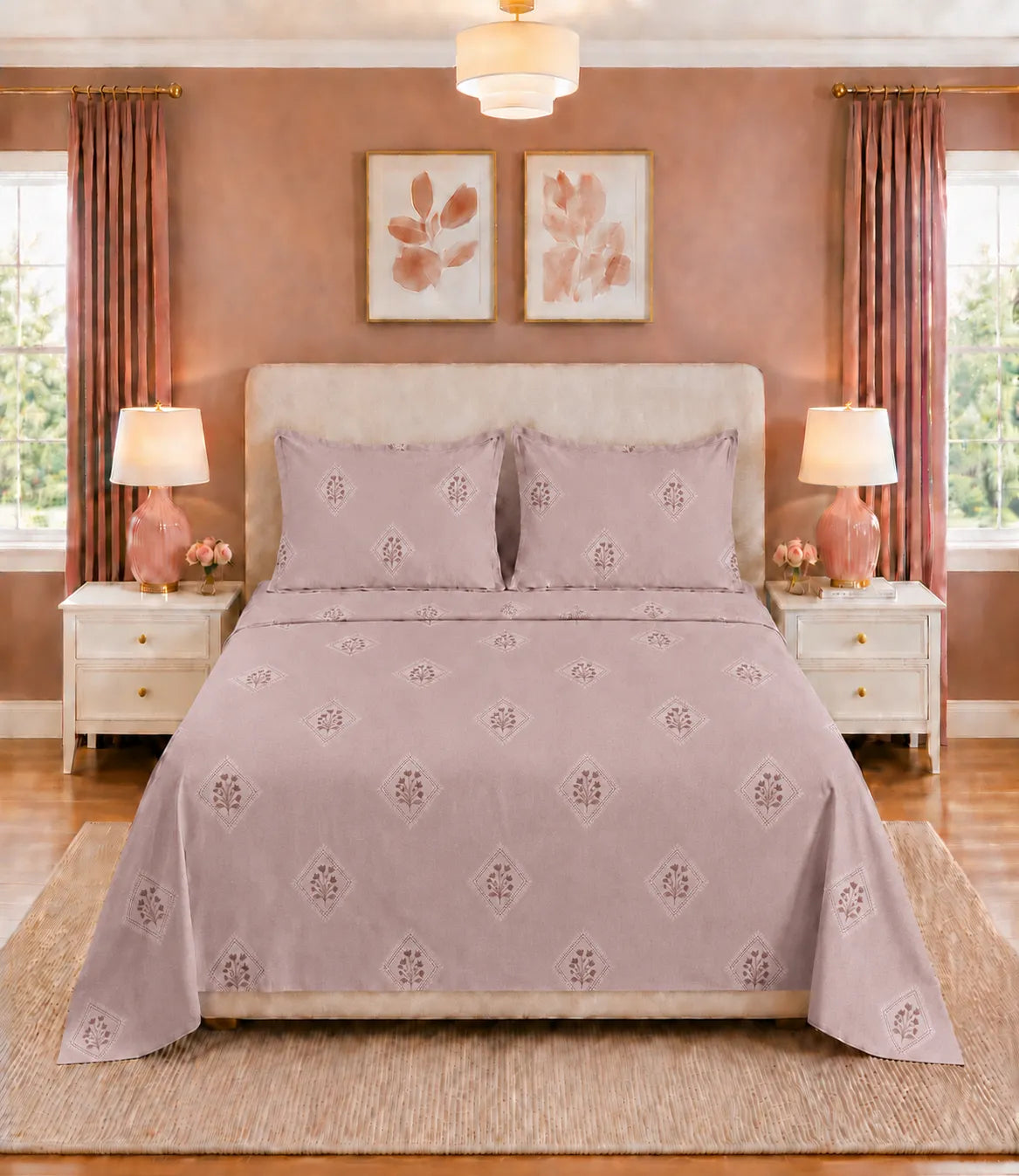 King size Rose Mist cotton bedsheet featuring geometric floral print with two matching pillow covers on a neatly made bed.