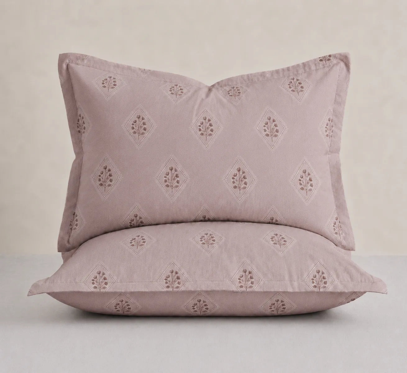 Matching Rose Mist cotton pillow covers with elegant geometric floral print for king size bedsheet set.