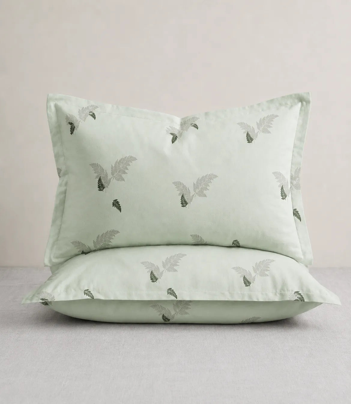 King Size matching sage green cotton pillow covers with delicate fern leaf print, soft and stylish bedding accessories for modern bedrooms.