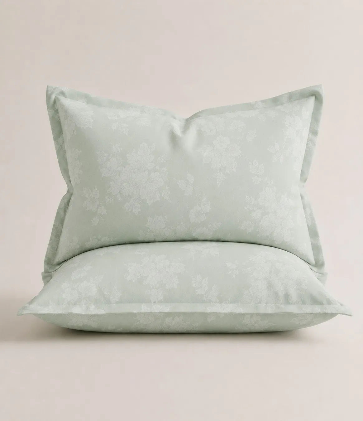 Matching king size mint green floral pillowcase with delicate white botanical pattern and soft, breathable fabric.