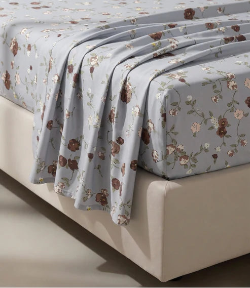 Close-up of a premium 100% pure cotton floral bedsheet showcasing its smooth breathable cotton fabric, elegant brown and blush floral design, soft weave, and luxurious natural drape.