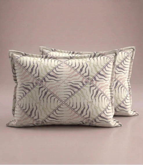 Matching 100% pure cotton pillow covers featuring a contemporary abstract wave geometric pattern in blush pink, ivory, sage green, and charcoal grey for a modern bedroom.