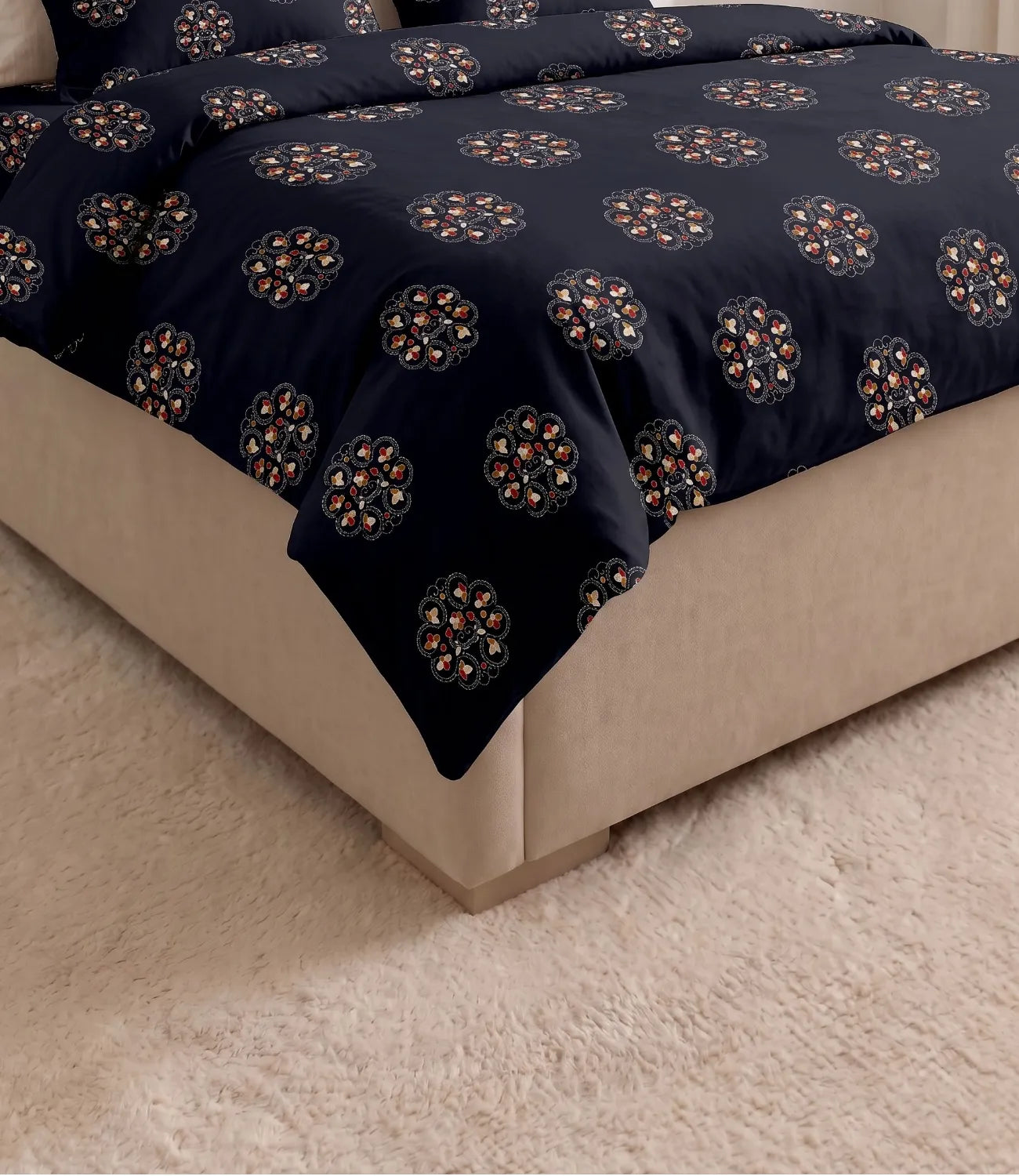 Detailed corner view of the queen size midnight navy cotton bedsheet draped over a bed, highlighting the evenly spaced floral medallion pattern, smooth fabric finish, and elegant fit on the mattress.