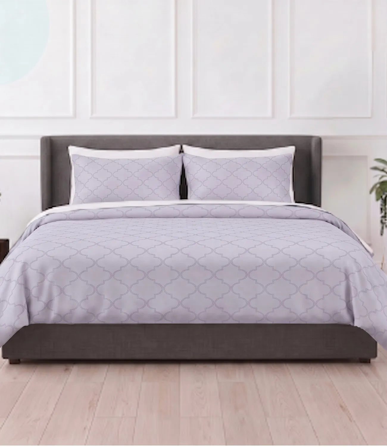 Silver grey king size cotton bedsheet with elegant geometric pattern and matching pillow covers styled in a modern luxury bedroom.