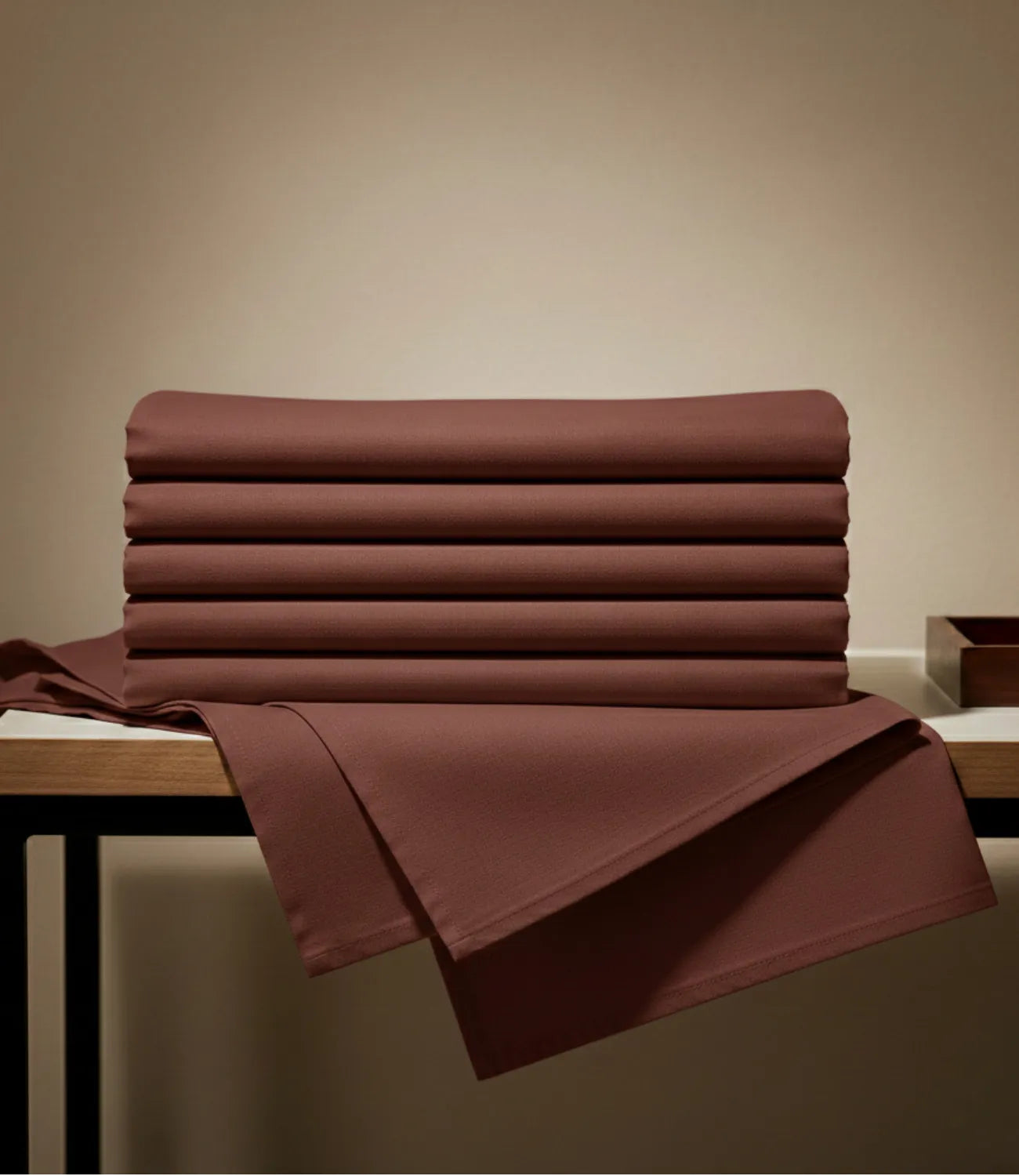 Folded coffee brown king size cotton bedsheet set with matching pillow covers, highlighting premium fabric, smooth texture, and elegant finish.