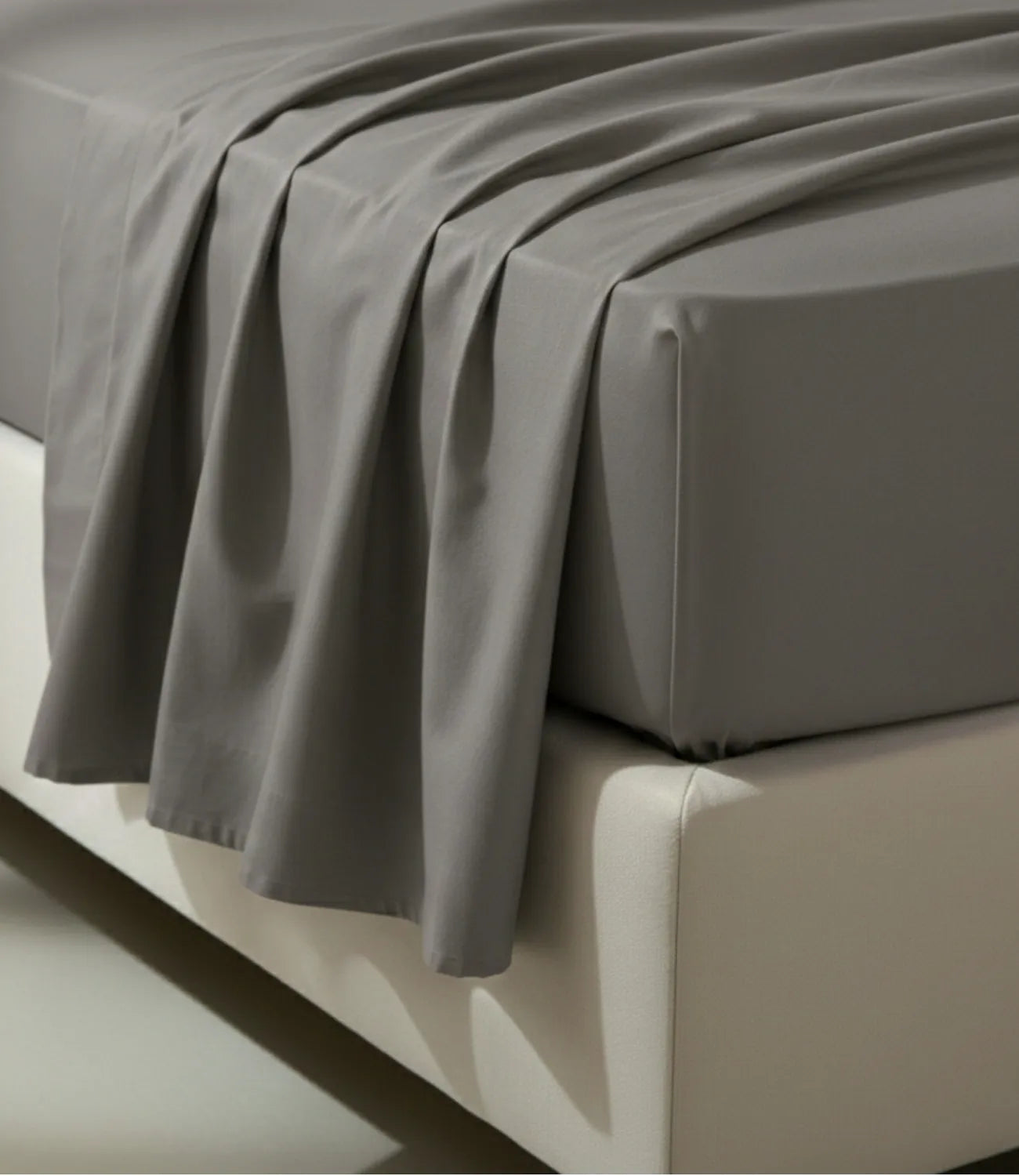 Close-up of Soft Heaven dark grey king size cotton fitted bedsheet highlighting smooth drape, neat stitching, and premium cotton fabric.