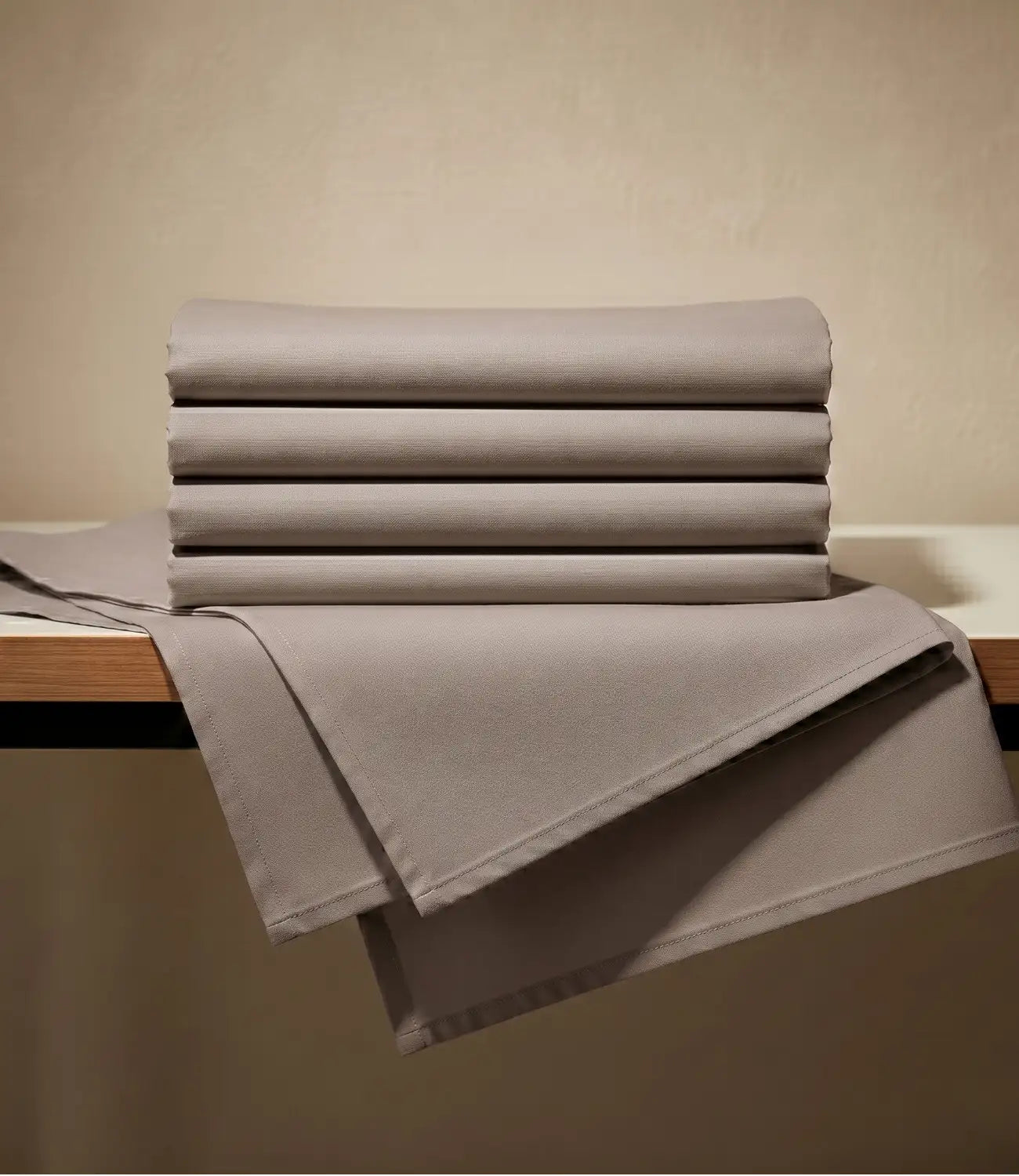 Folded king size 100% pure cotton mocha solid bedsheet showcasing breathable cotton fabric, smooth texture, premium craftsmanship, durable stitching, and long-lasting everyday comfort.