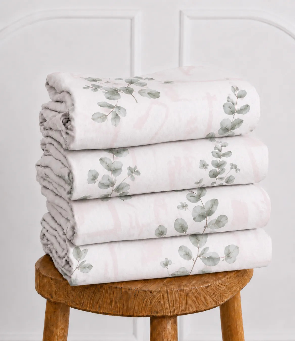 Folded Arizona Blush Eucalyptus queen size cotton bedsheet showcasing soft botanical leaf print and premium fabric