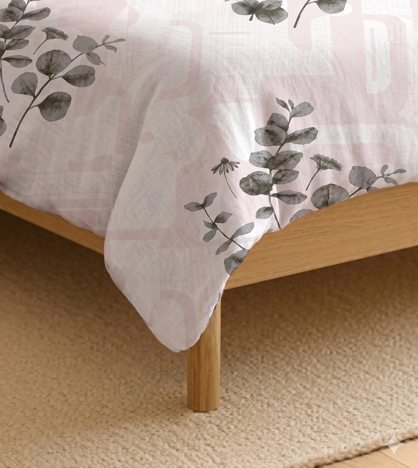 Close-up of blush eucalyptus botanical print cotton bedsheet highlighting soft fabric texture and elegant floral design