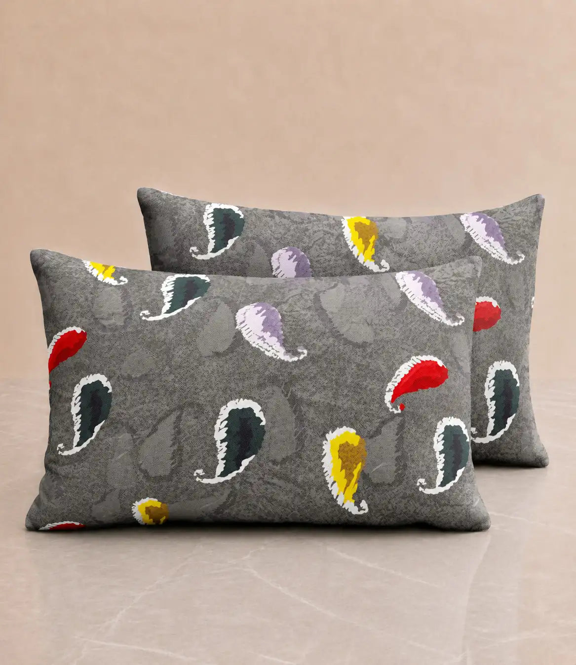 Matching 100% cotton pillow covers with charcoal grey background and multicolor paisley print for a stylish and contemporary bedroom.