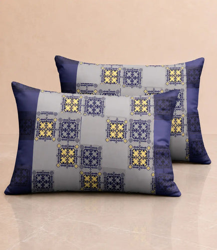 Matching 100% cotton pillow covers with royal blue, grey, and mustard yellow ethnic geometric print for a contemporary bedroom décor.