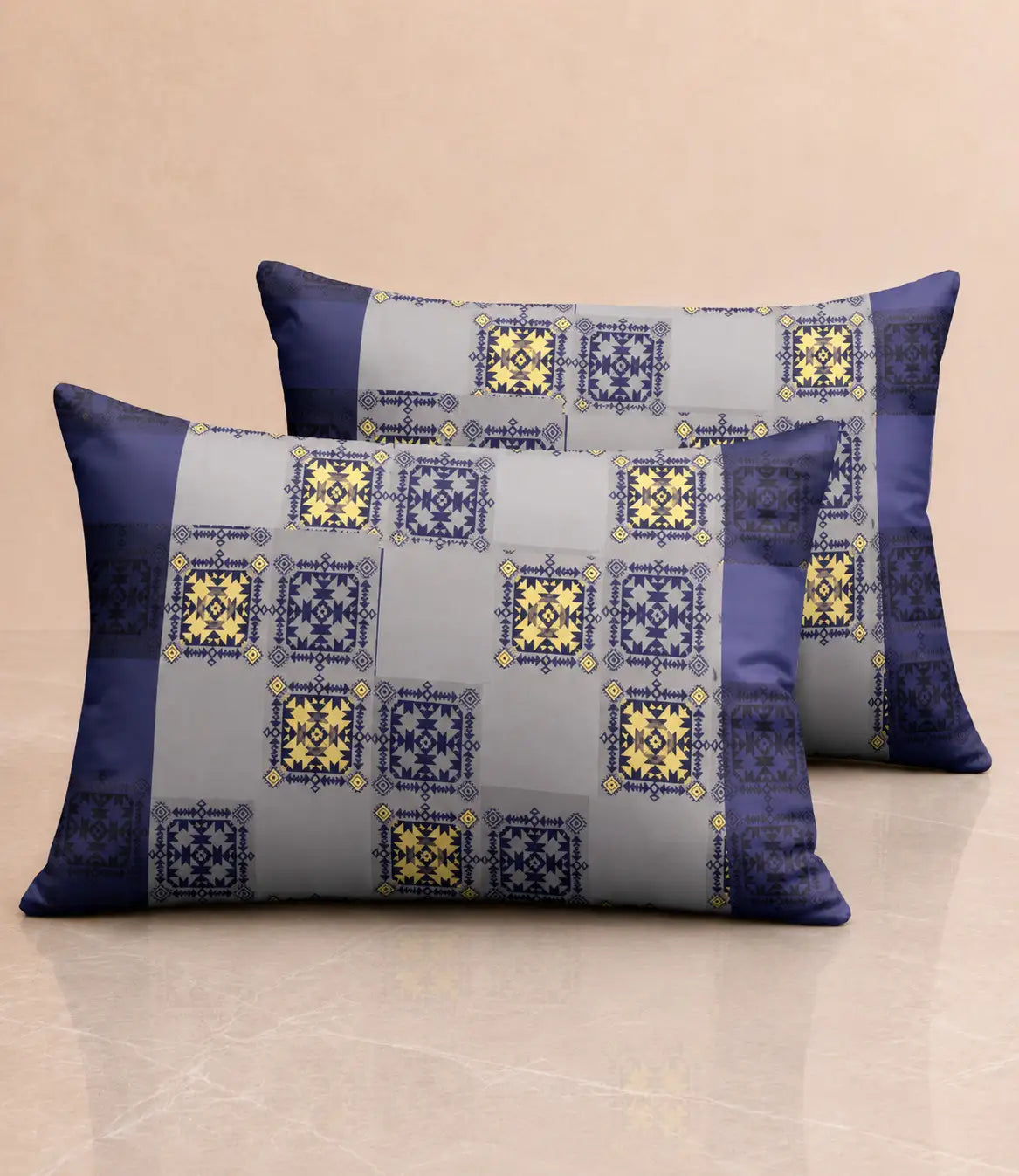 Matching 100% cotton pillow covers with royal blue, grey, and mustard yellow ethnic geometric print for a contemporary bedroom décor.
