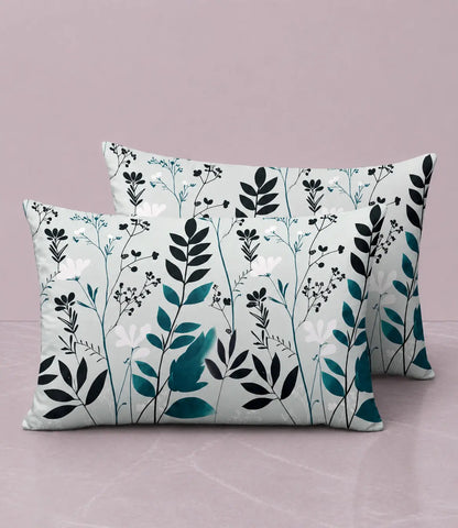 Set of premium cotton pillow covers featuring an elegant sage green, teal, black, and white botanical floral print on a soft fabric.