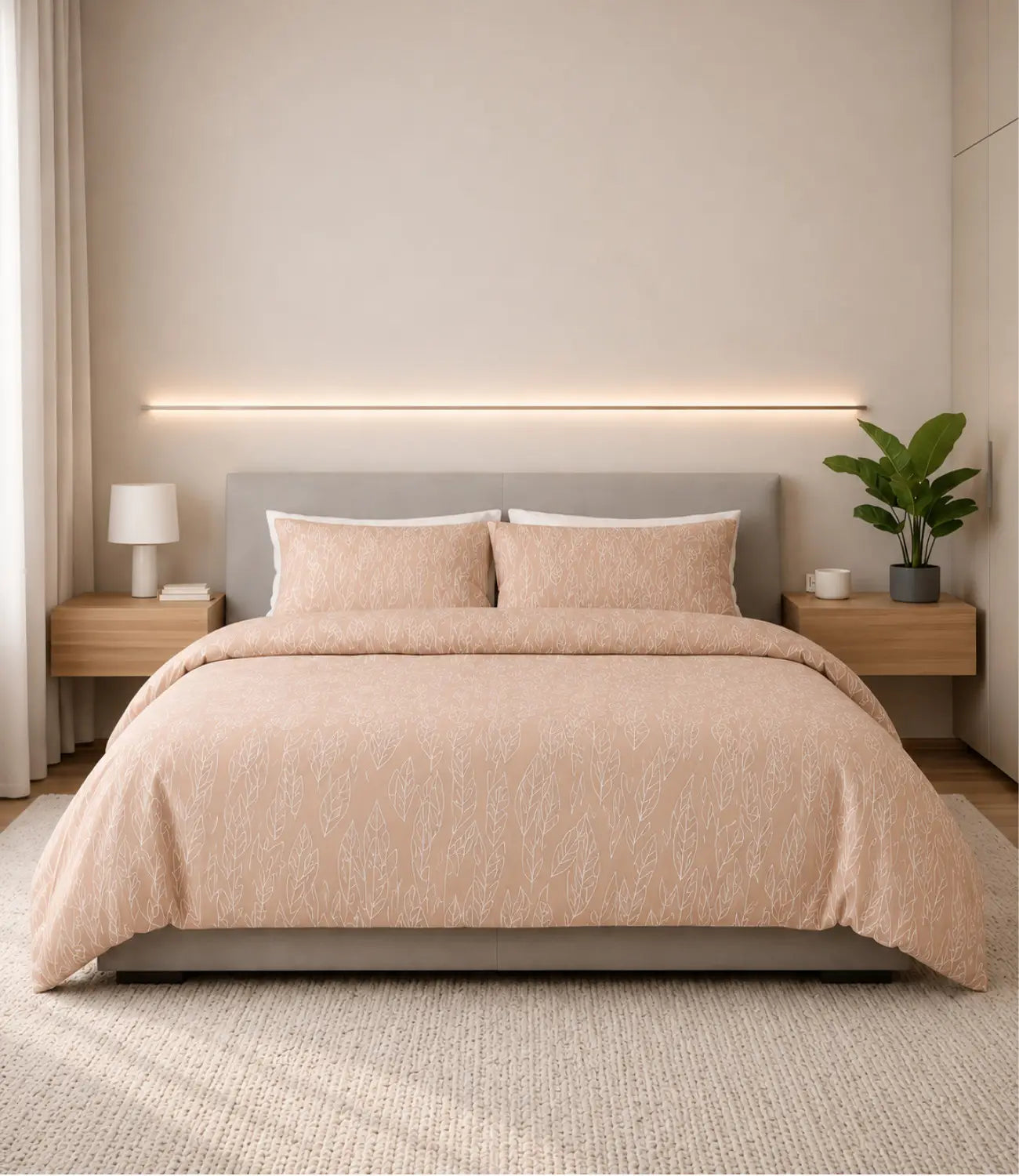 Premium peach blossom 100% cotton bedsheet set with matching pillow covers featuring a soft botanical leaf print in a modern minimalist bedroom.