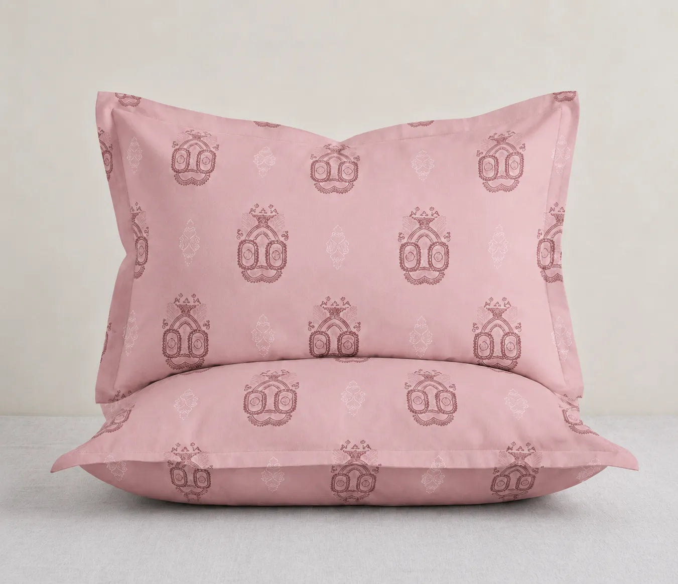 King Size pink printed pillow cover with intricate traditional ornamental motifs, crafted from soft and breathable fabric with a smooth finish.