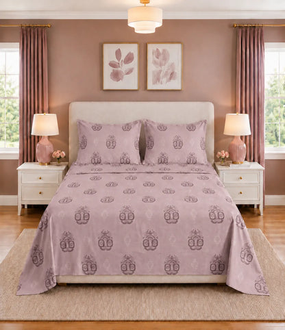 Front view of king size dusty rose cotton bedsheet featuring an intricate medallion pattern with two matching pillow covers, offering a soft, elegant, and timeless bedroom look.