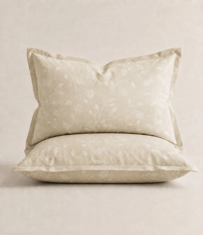 Matching ivory botanical vine printed king size pillow covers made from soft cotton with an elegant minimalist floral design.