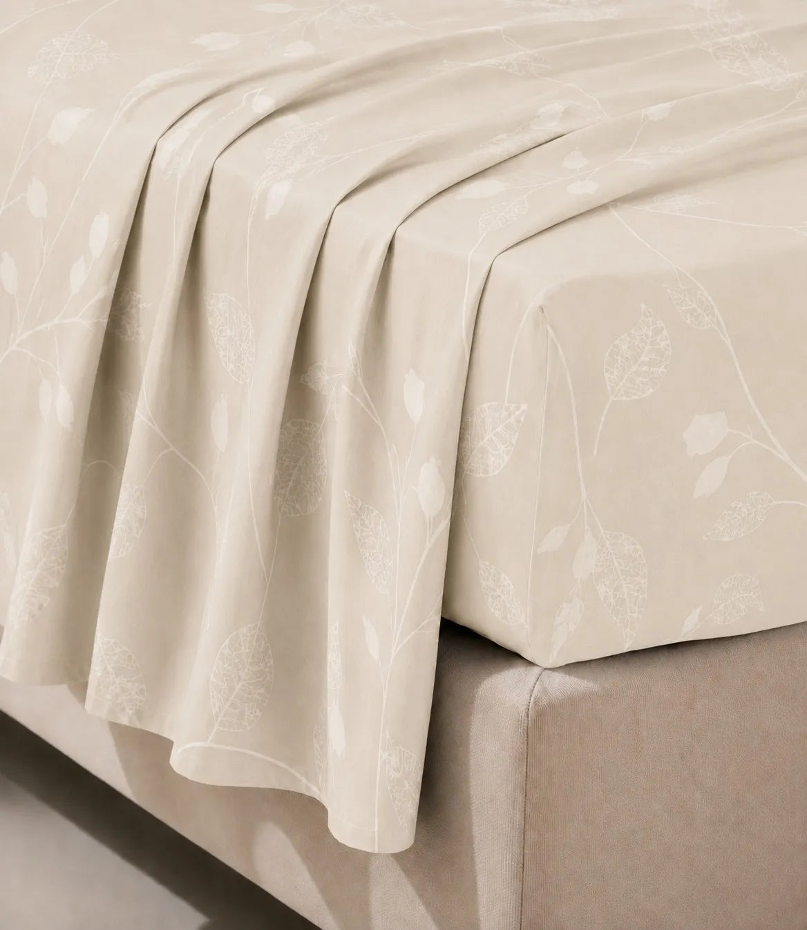 Close-up of king size ivory cotton bedsheet highlighting the smooth fabric texture and delicate botanical vine print.