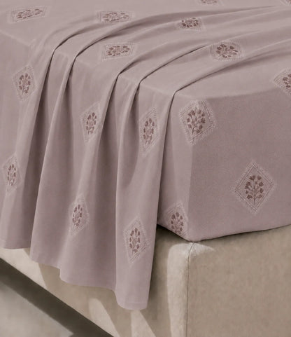 Close-up of Rose Mist king size cotton bedsheet highlighting soft fabric, geometric floral print, and smooth drape.