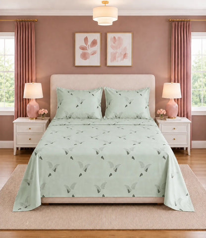 King Size sage green botanical printed cotton bedsheet with matching pillow covers, featuring a minimal fern leaf design for elegant bedrooms.