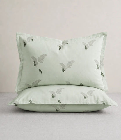 King Size matching sage green cotton pillow covers with delicate fern leaf print, soft and stylish bedding accessories for modern bedrooms.