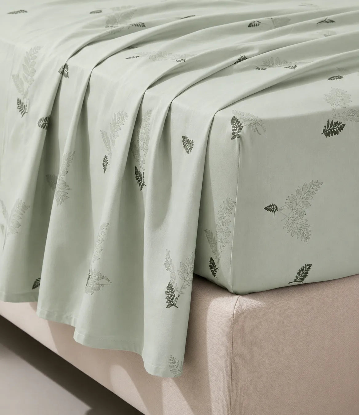Close-up of King Size sage green cotton bedsheet featuring a minimalist fern leaf print, smooth breathable fabric with premium finish.