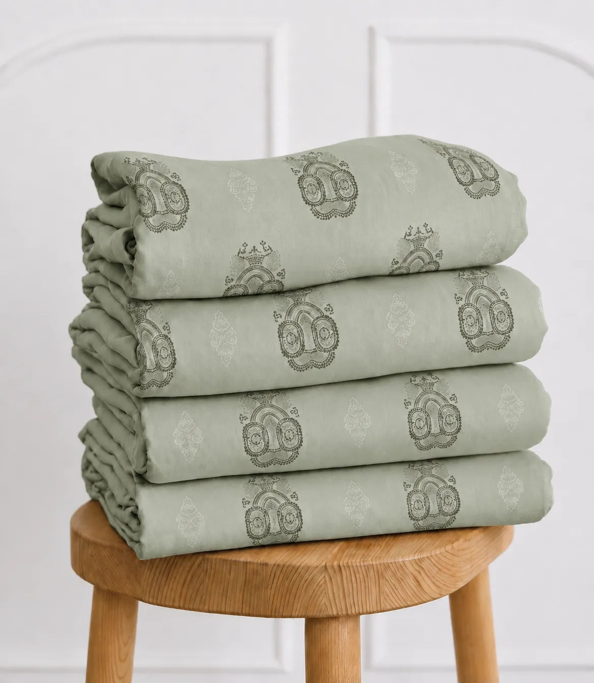 Folded Elite Weave King Size sage green cotton bedsheet set with decorative medallion print showcasing soft, breathable fabric.
