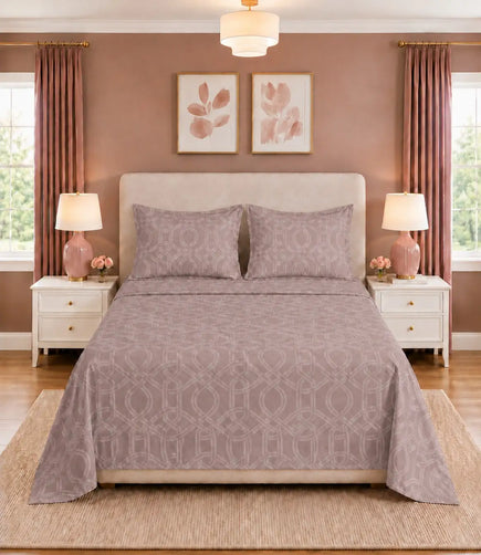 Front view of blush mauve geometric king size cotton bedsheet set with matching pillow covers in an elegant modern bedroom.
