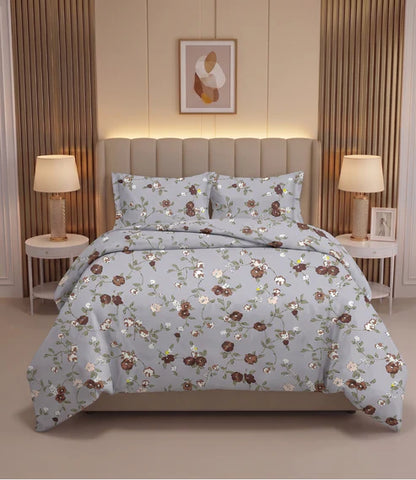 Premium queen size 100% pure cotton bedsheet featuring delicate brown and blush pink floral prints on a soft light grey background, elegantly styled in a modern luxury bedroom with matching pillow covers for a timeless and comfortable sleeping experience.