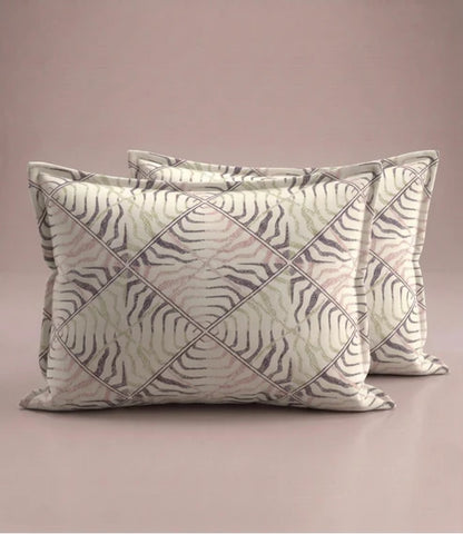 Matching 100% pure cotton pillow covers featuring a contemporary abstract wave geometric pattern in blush pink, ivory, sage green, and charcoal grey for a modern bedroom.