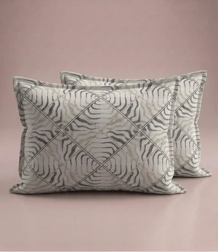 Matching 100% pure cotton pillow covers with an elegant abstract wave geometric pattern in ivory, taupe, sage green, and charcoal for a modern bedroom décor.