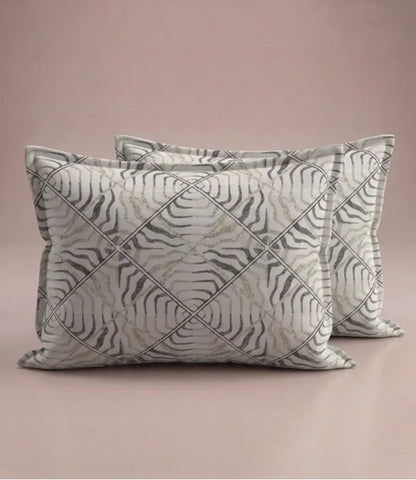 Matching 100% pure cotton pillow covers with an elegant abstract wave geometric pattern in ivory, taupe, sage green, and charcoal for a modern bedroom décor.