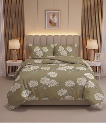 Premium queen size 100% pure cotton bedsheet featuring elegant white floral prints with sage green leaves on a warm olive beige background, beautifully styled in a modern luxury bedroom with matching pillow covers for a soft, sophisticated, and comfortable sleeping experience.