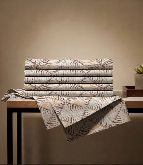 Folded queen size 100% pure cotton bedsheet showcasing a modern beige abstract geometric design in soft breathable cotton fabric.