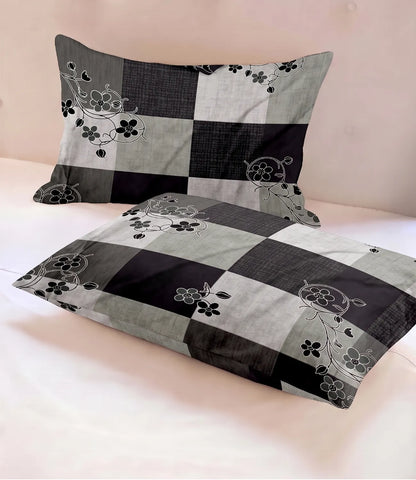 Matching 100% pure cotton pillow covers featuring a charcoal grey, black, and light grey checkered design with delicate floral vine accents, offering breathable comfort and timeless modern elegance.