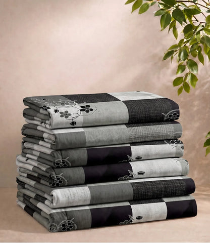Folded queen size 100% pure cotton charcoal grey checkered bedsheet showcasing a contemporary floral check pattern, soft breathable cotton fabric, premium craftsmanship, and everyday comfort.