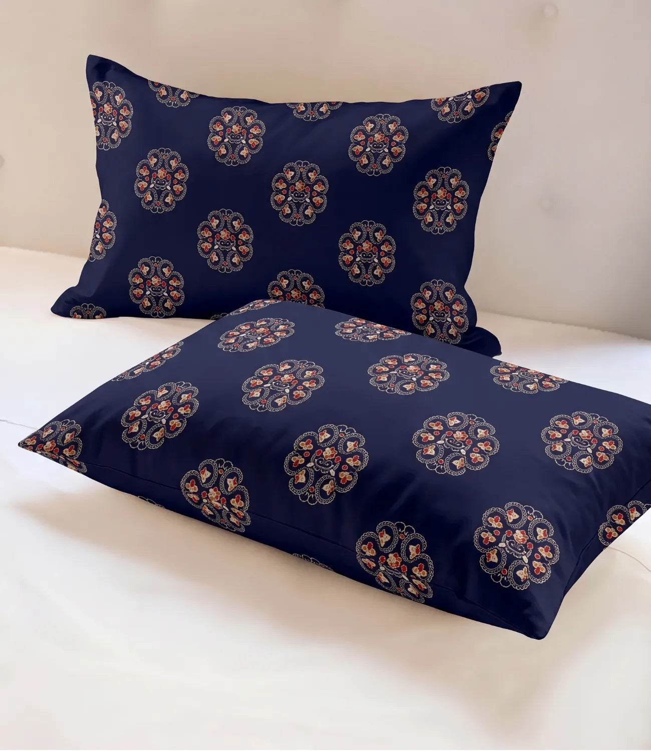 Close-up of the matching queen size pillow covers showcasing the intricate floral medallion print on a rich midnight navy cotton fabric. The smooth texture and coordinated design highlight the premium finish.