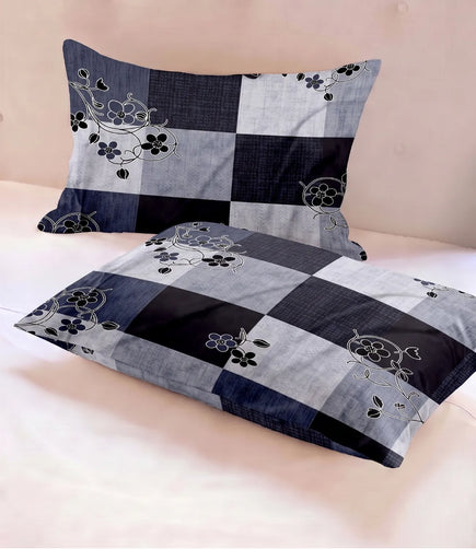 Matching 100% pure cotton pillow covers with a navy blue and grey checkered design accented by delicate floral vine motifs, offering breathable comfort and contemporary elegance.