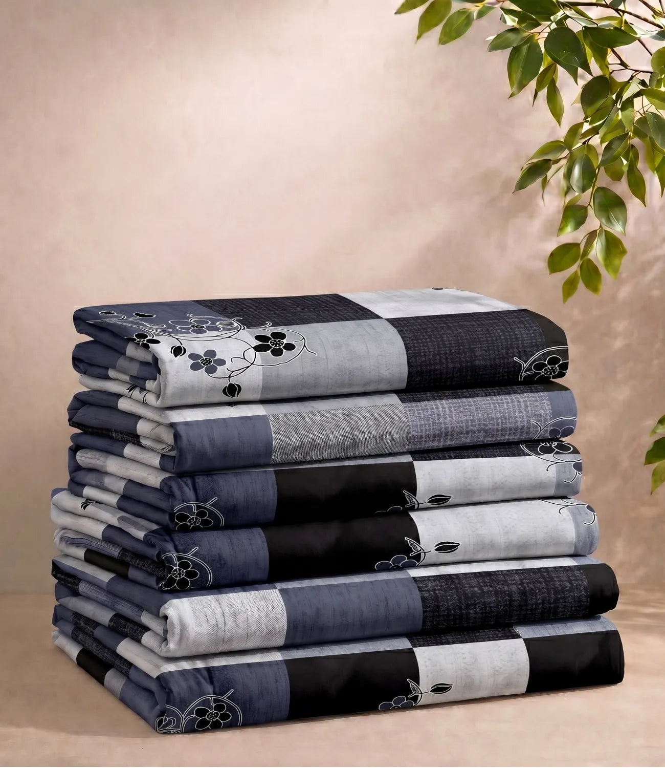 Folded queen size 100% pure cotton navy blue checkered bedsheet showcasing a stylish floral pattern, soft breathable cotton fabric, premium craftsmanship, and everyday comfort.