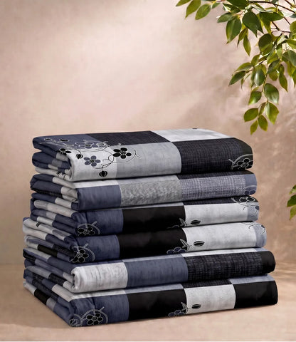 Folded queen size 100% pure cotton navy blue checkered bedsheet showcasing a stylish floral pattern, soft breathable cotton fabric, premium craftsmanship, and everyday comfort.