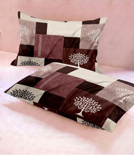 Set of two matching queen-size cotton pillow covers with a maroon, brown, beige, and cream patchwork pattern accented by white tree prints. Soft fabric with a contemporary rustic design.