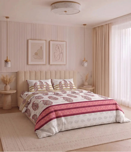 Premium king size 100% cotton bedsheet with a blush pink floral paisley print and matching pillow covers styled in a modern luxury bedroom.