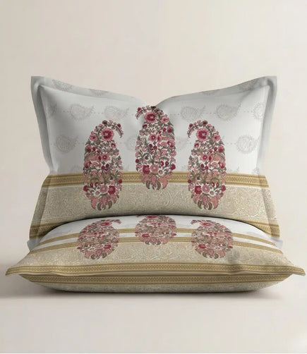 Matching 100% cotton pillow cover featuring a blush pink floral paisley motif with an elegant decorative border on a soft white background.