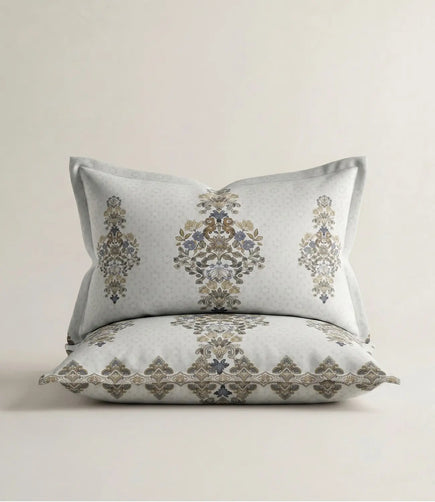Matching 100% cotton pillow cover featuring an elegant cream floral motif with decorative border on a soft cream background.