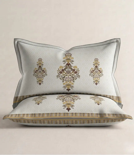 Matching 100% cotton pillow cover featuring an elegant ivory floral motif with decorative striped border on a soft white background.