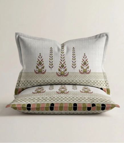 Matching 100% cotton pillow cover featuring a sage green traditional floral motif with an elegant geometric border on a soft white background.