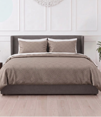 Premium king size 100% pure cotton mocha brown geometric bedsheet with matching pillow covers, styled in a modern bedroom featuring breathable fabric, soft texture, and an elegant contemporary circular pattern.